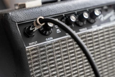 Why is my guitar amp buzzing? And why does it sound like a swarm of bees at a tea party?